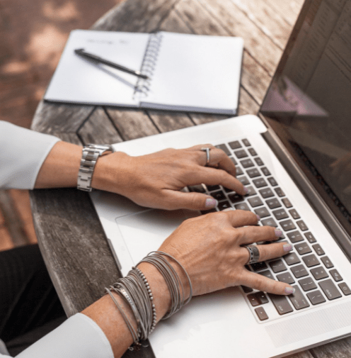 Woman typing on laptop